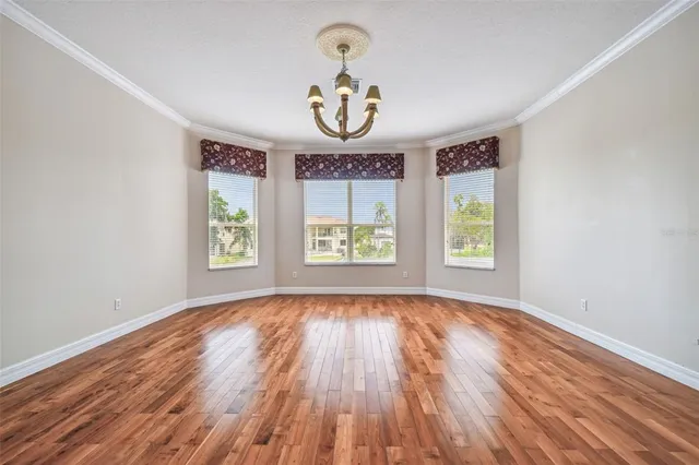 an aerial view of residential houses with outdoor space and parking space