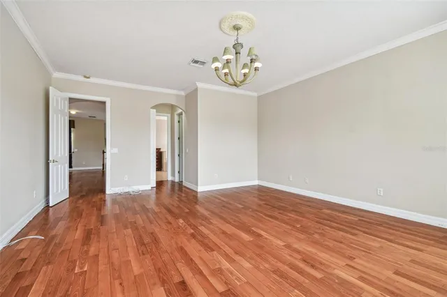 an aerial view of a house with a garden and lake view