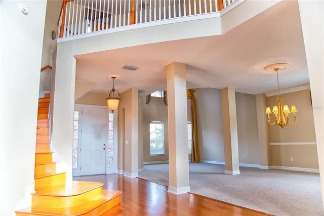 a kitchen with stainless steel appliances granite countertop a sink and a refrigerator
