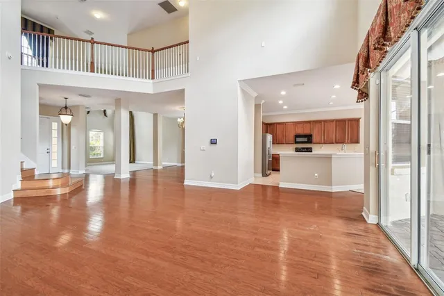 a kitchen with a stove a sink and a window
