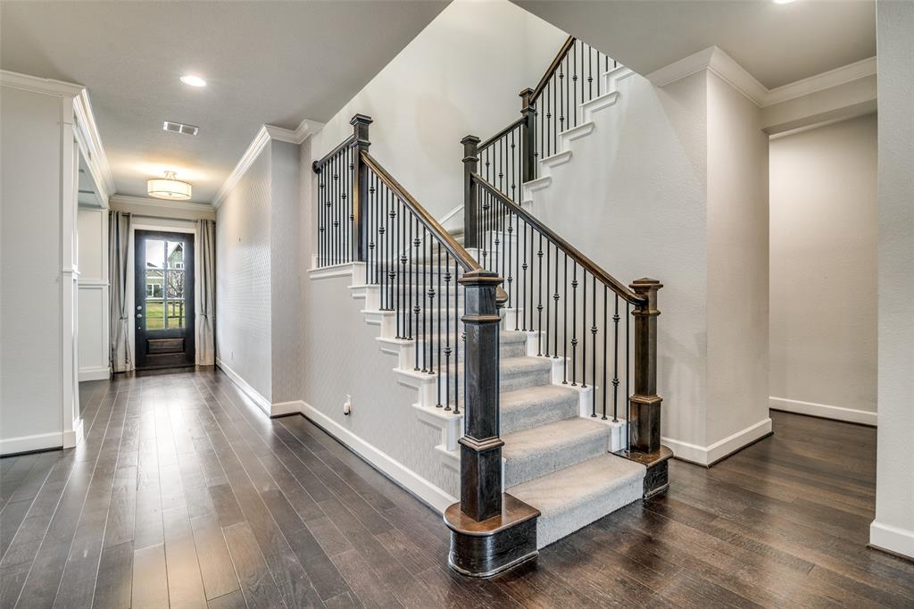 8917 Homestead Boulevard Rowlett, TX 75089 - Photo 16 of 40 a view of entryway with wooden floor and stairs