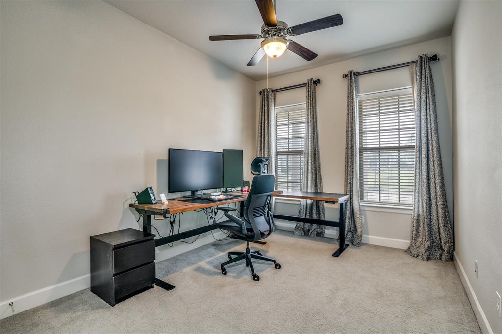 8917 Homestead Boulevard Rowlett, TX 75089 - Photo 22 of 40 a living room with furniture and a flat screen tv