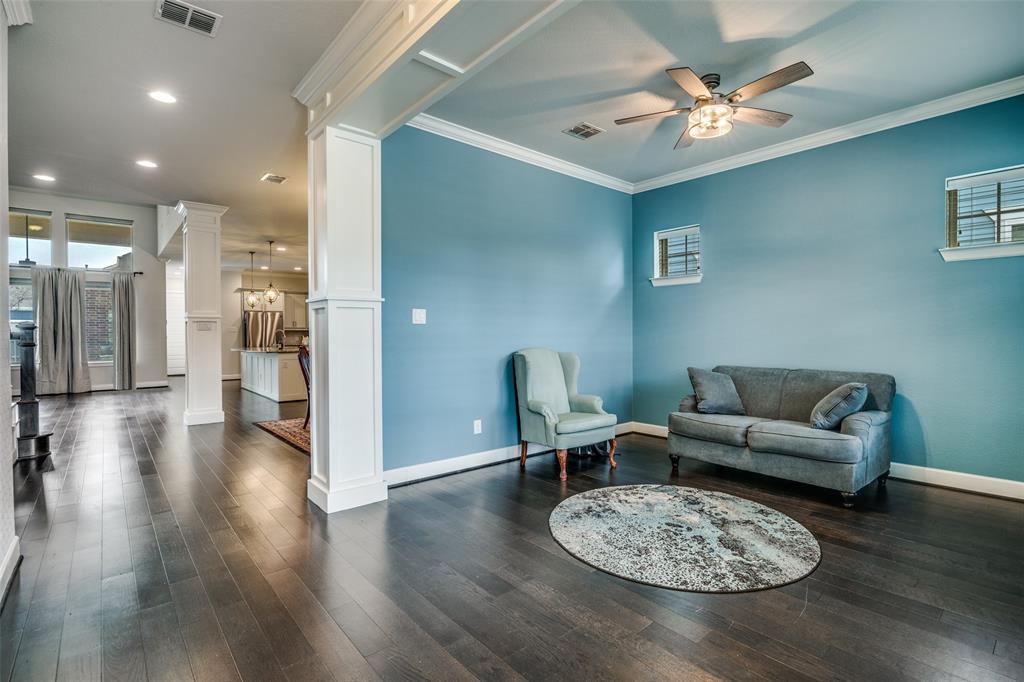 8917 Homestead Boulevard Rowlett, TX 75089 - Photo 7 of 40 a living room with furniture and a wooden floor