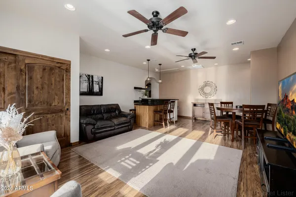 a work room with furniture and wooden floor