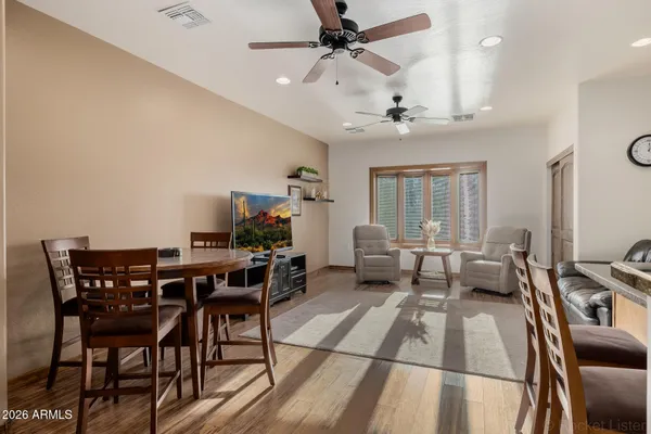 a bedroom with furniture and a mirror