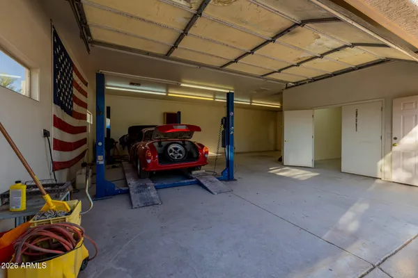an aerial view of a house with a yard and garden