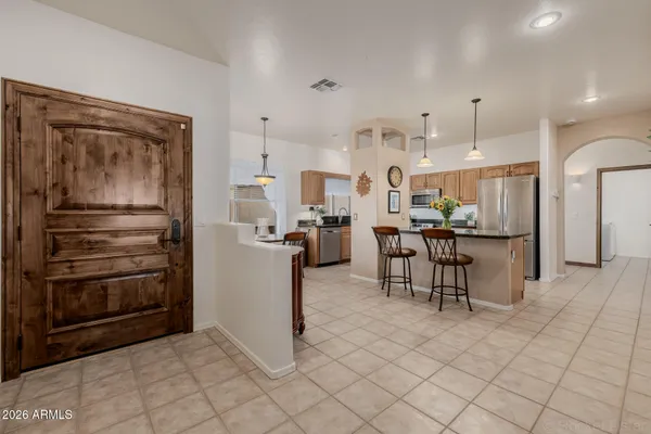 a dining room with furniture and window