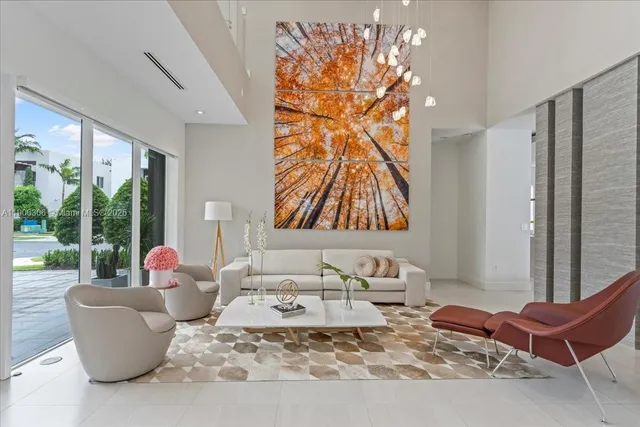 a living room with furniture and a potted plant