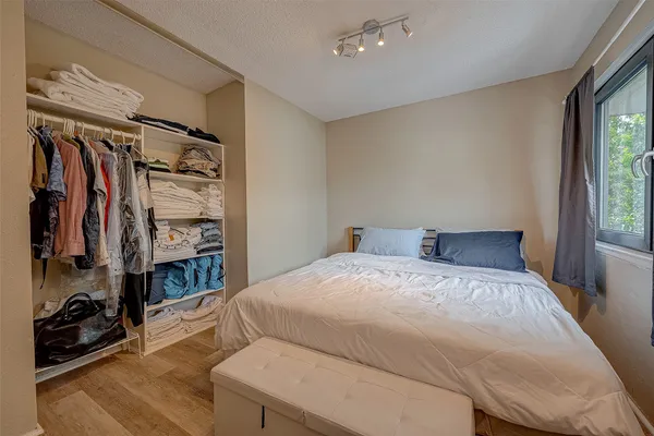 a bed room with a bed and a window