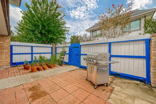 a view of a chairs and table in the patio