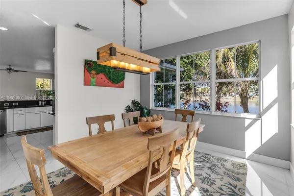 a dining room with furniture and window