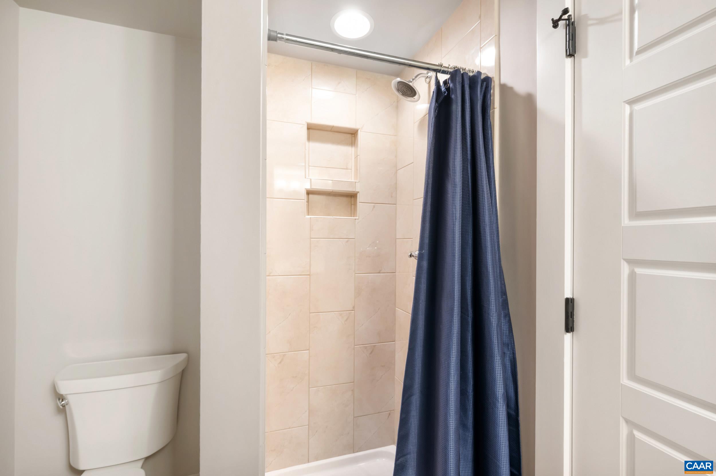 1411 Terrace Lane Charlottesville, VA 22911 - Photo 36 of 72 a bathroom with a shower and a toilet
