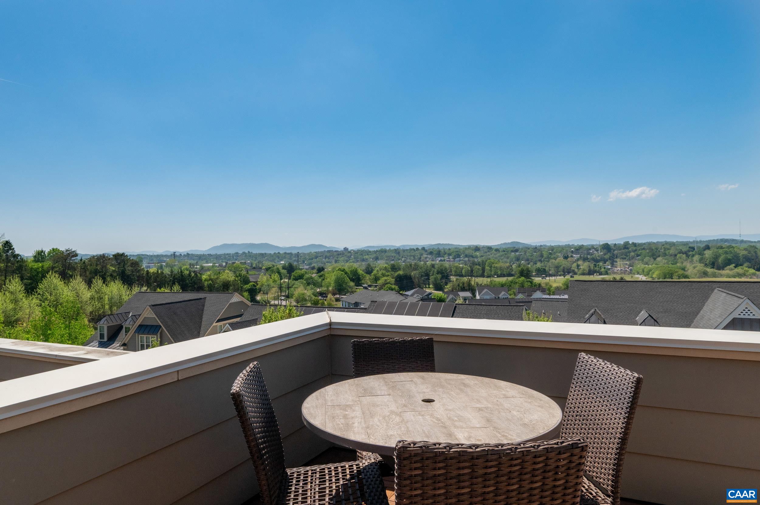 1411 Terrace Lane Charlottesville, VA 22911 - Photo 52 of 72 a view of a balcony with a table and chairs