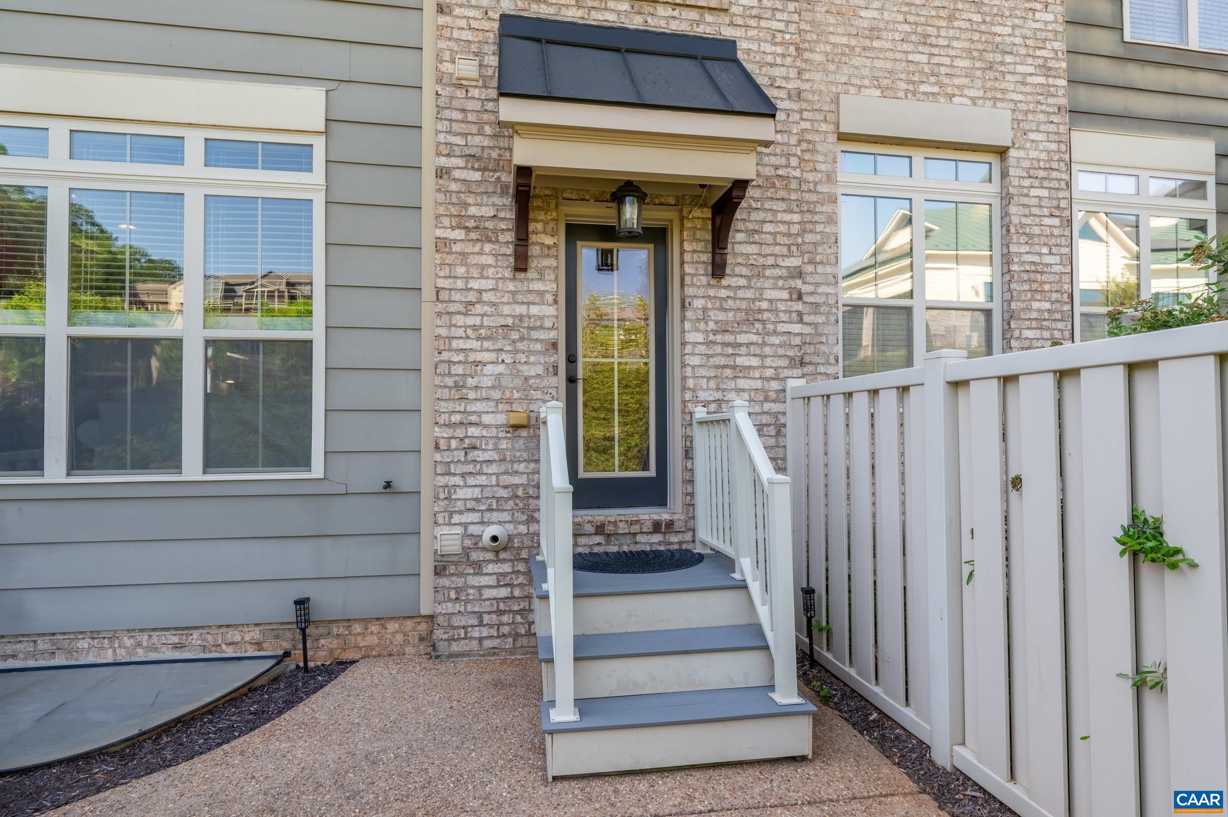 1411 Terrace Lane Charlottesville, VA 22911 - Photo 57 of 72 a view of a brick house with wooden door and a window