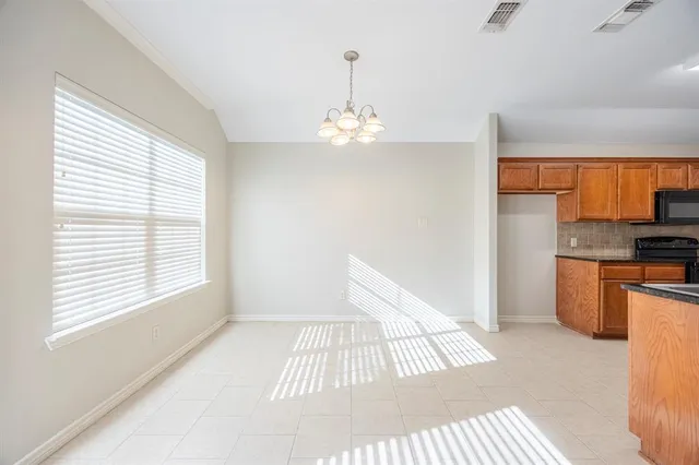 a view of kitchen and hallway with window