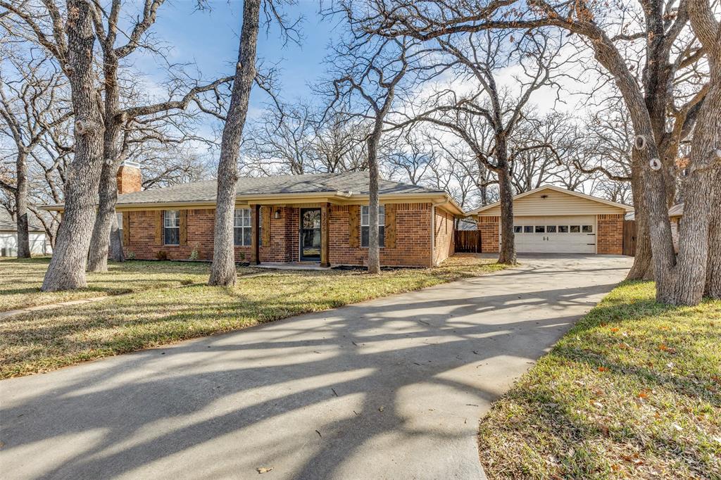 a view of a house with a large trees