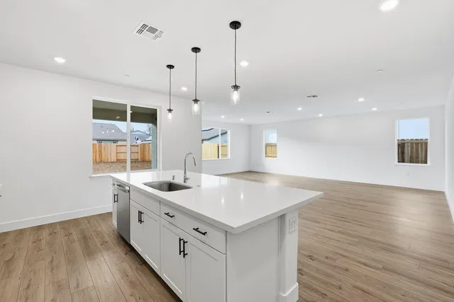 a kitchen with a sink and window