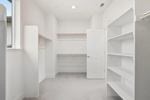a bathroom with a shower sink and mirror