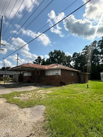 a view of swimming pool with an outdoor seating