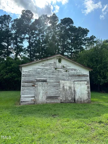 a view of a tiny house with a yard