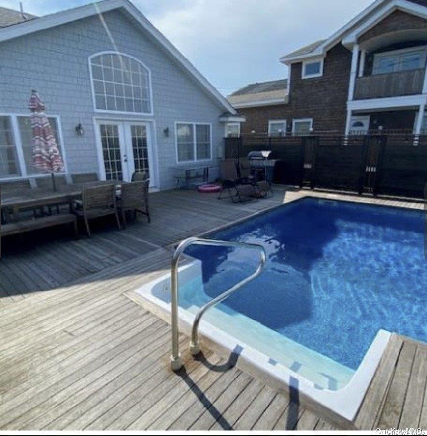 340 Surf Road Ocean Beach, NY 11770 - Photo 4 of 5 a swimming pool view with a outdoor seating