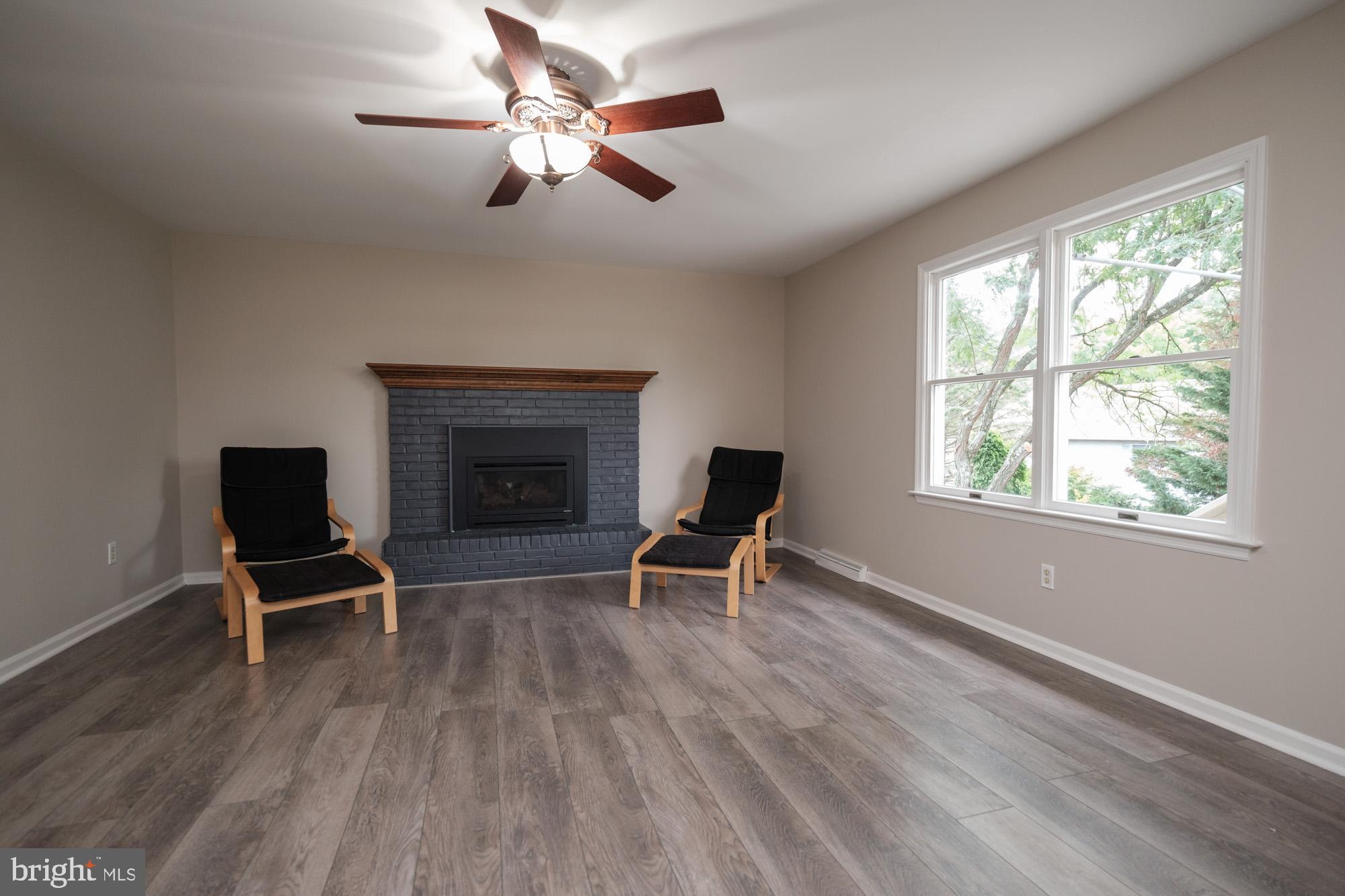 52 Rim View Lane Reading, PA 19607 - Photo 16 of 36 Family room with fireplace and large window