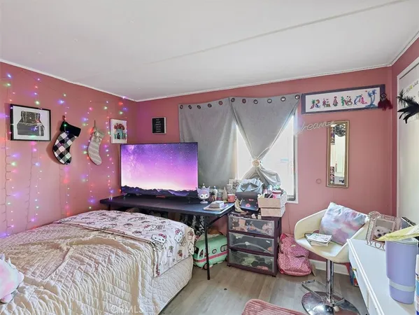 a bedroom with a bed and furniture