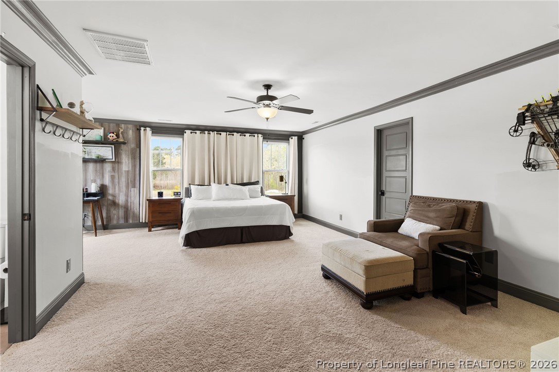 5535 Butler Nursery Road Fayetteville, NC 28306 - Photo 24 of 50 a bedroom with furniture and a ceiling fan