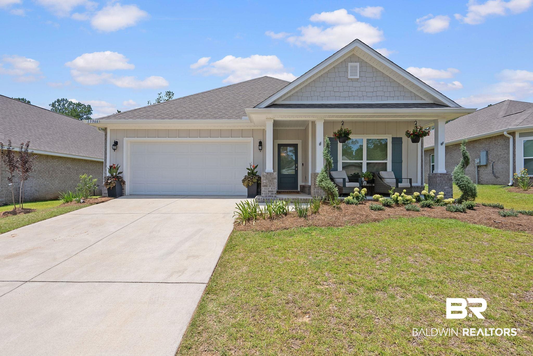 13966 Antler Hl Road Daphne, AL 36527 - Photo 30 of 44 Modern ranch-style home featuring a covered front porch, an attached garage, a concrete driveway, and established landscaping