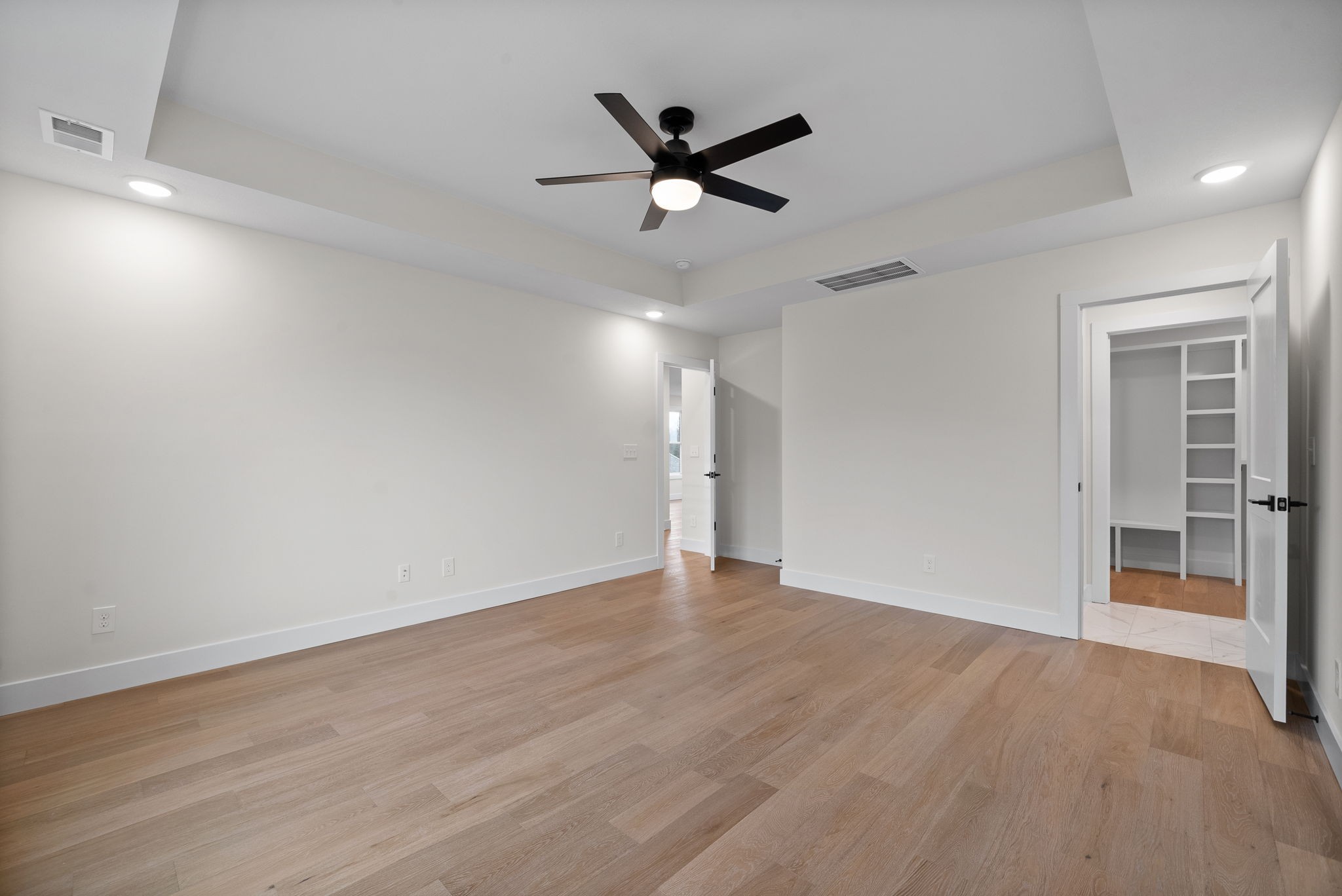 15 Rustling Oaks Court Pleasant View, TN 37146 - Photo 29 of 50 wooden floor in an empty room with a ceiling fan