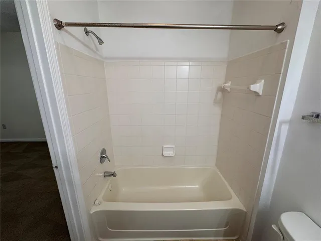 a couple of cars parked in front of a house