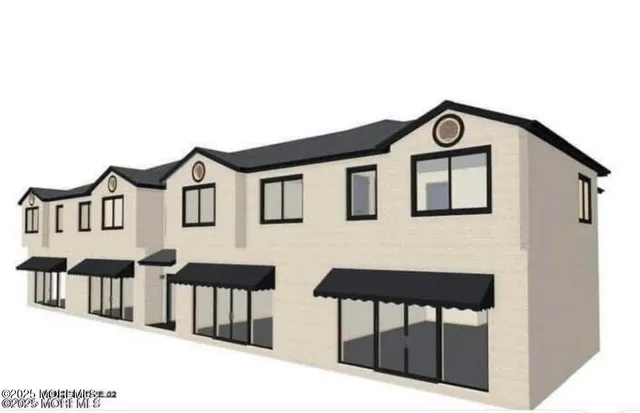 a view of a house with wooden fence