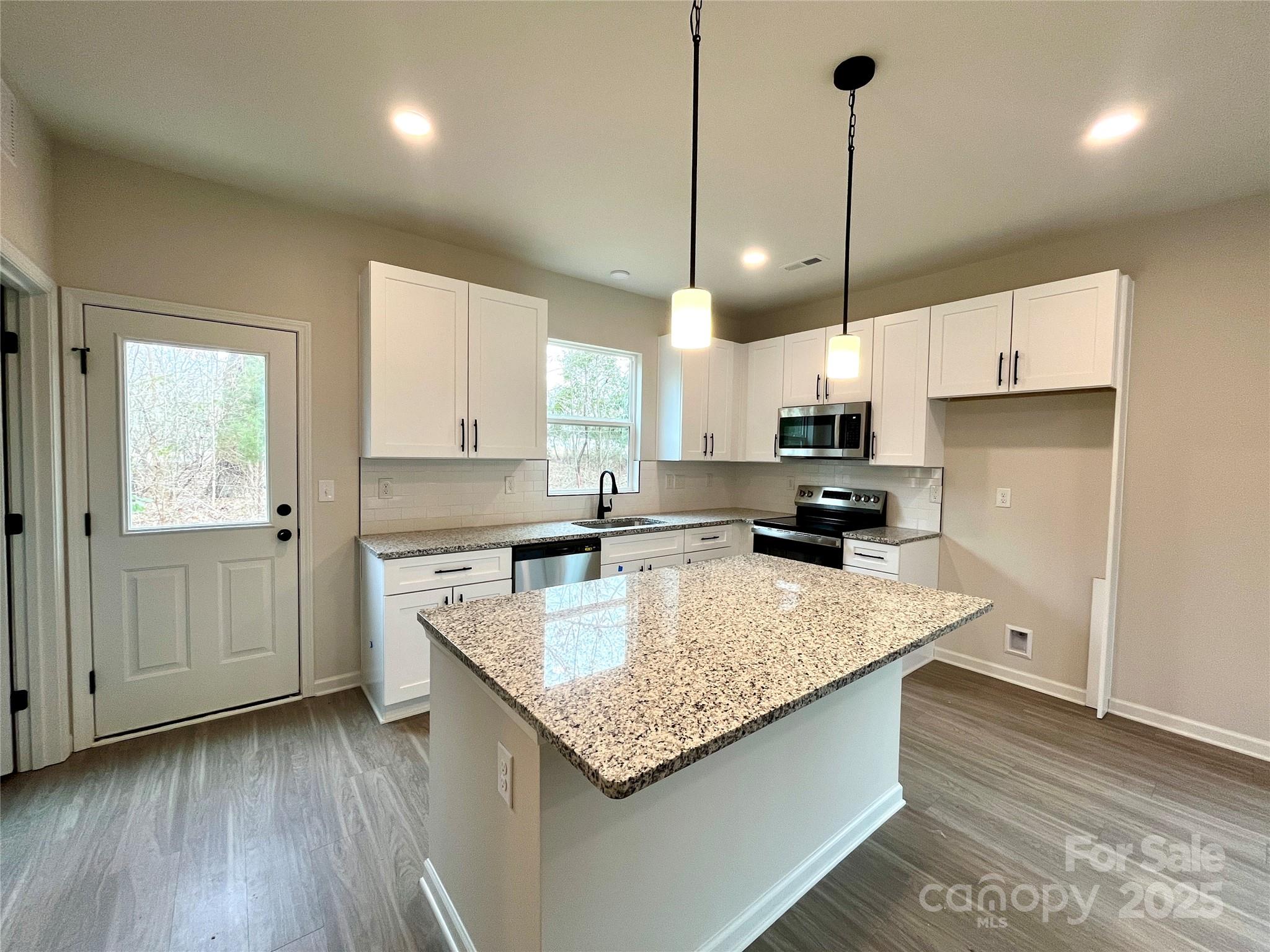 129 Sharon Road York, SC 29745 - Photo 7 of 21 a kitchen with a sink a counter top space appliances and cabinets