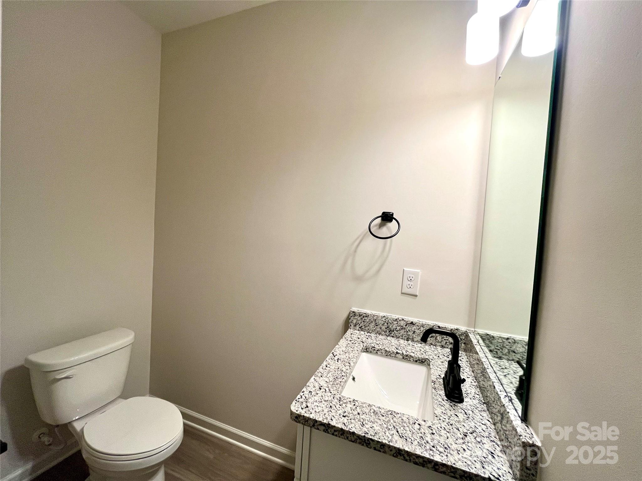 129 Sharon Road York, SC 29745 - Photo 10 of 21 a bathroom with a granite countertop sink and a toilet