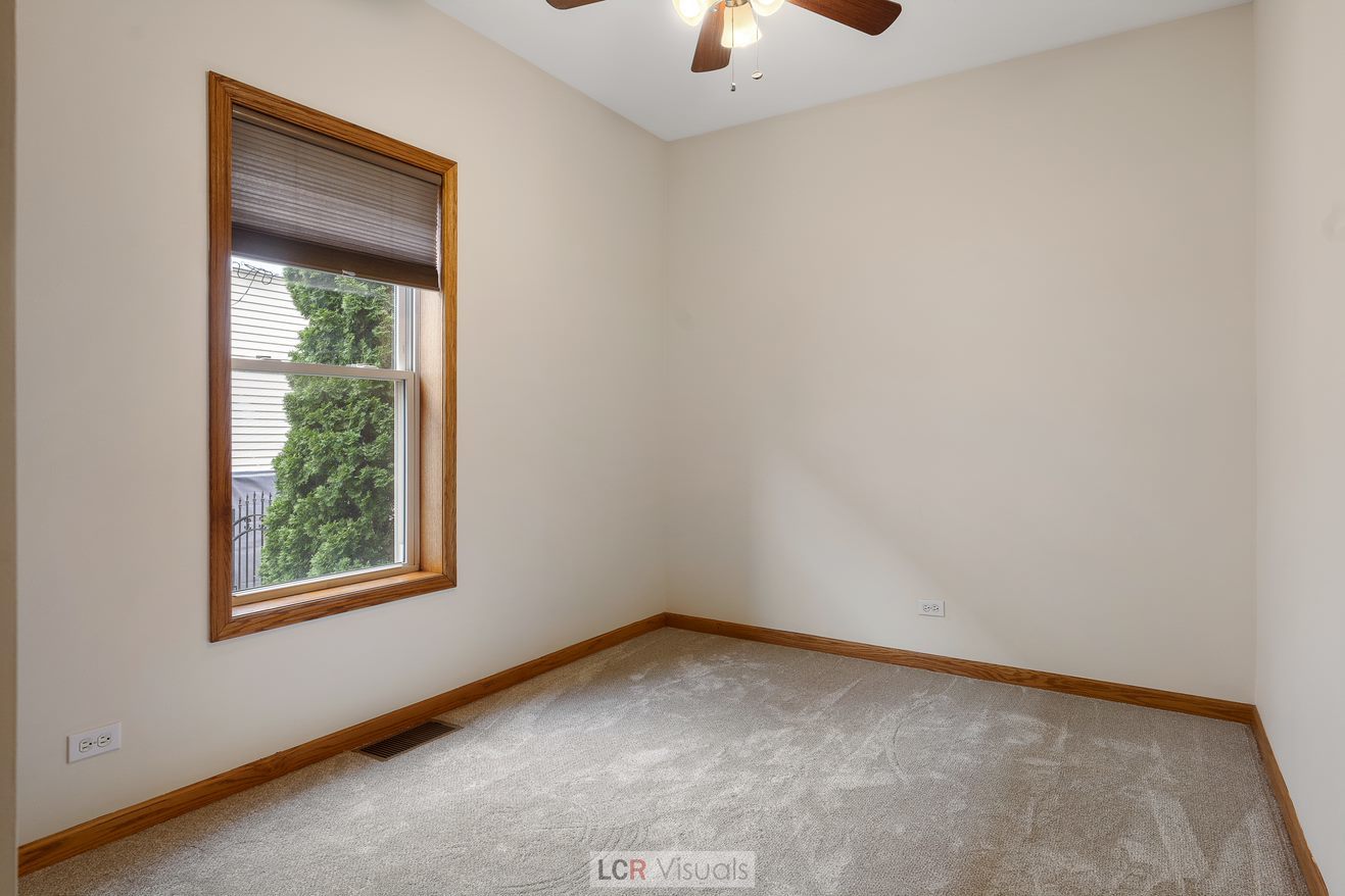 7112 West Belden Avenue Chicago, IL 60707 - Photo 12 of 19 an empty room with a window