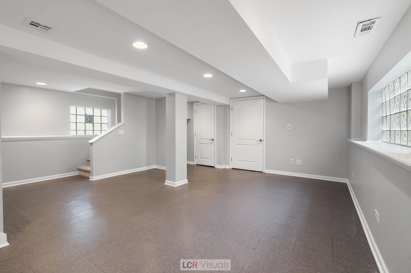 7112 West Belden Avenue Chicago, IL 60707 - Photo 14 of 19 an empty room with wooden floor and windows