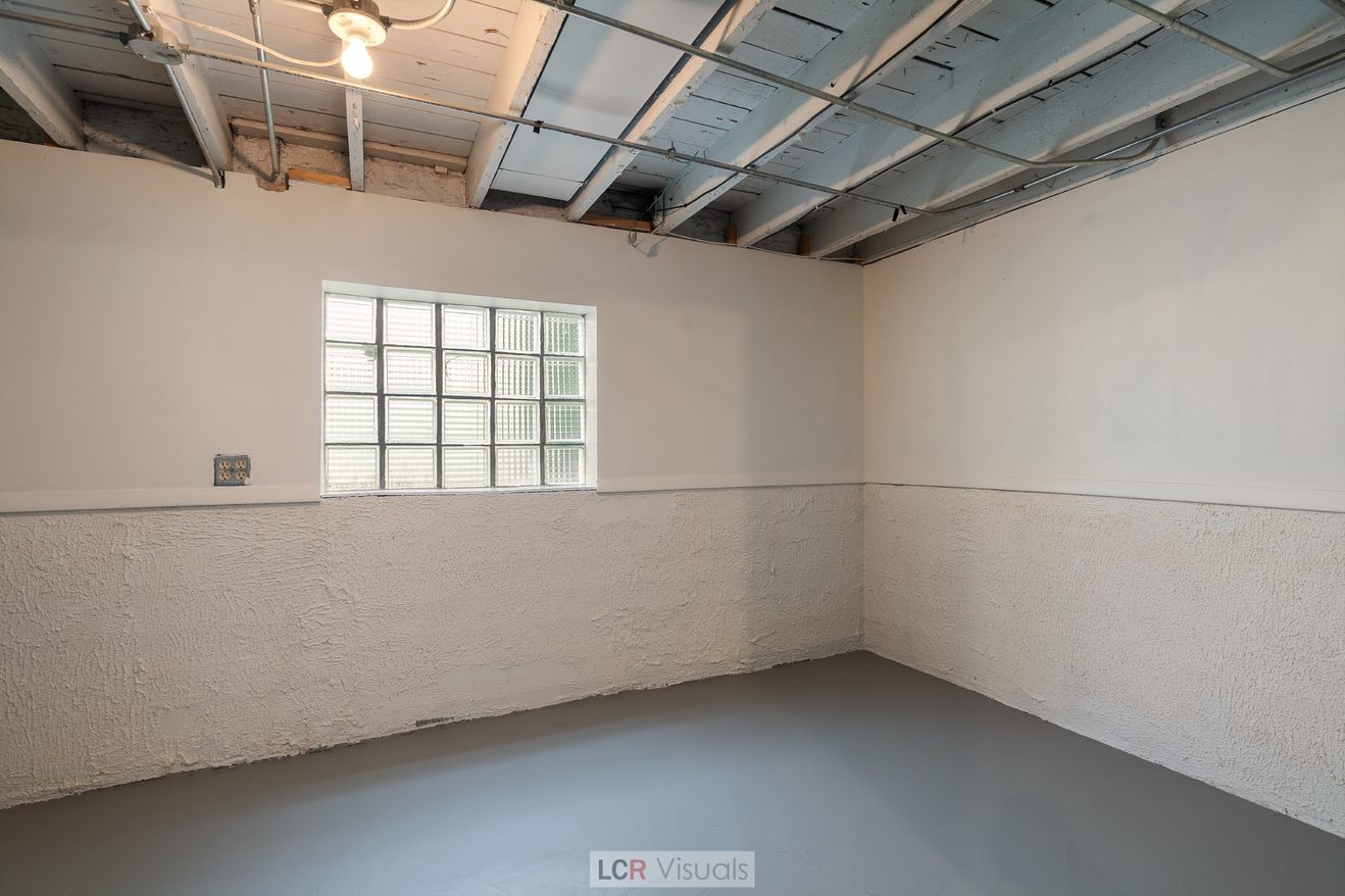 7112 West Belden Avenue Chicago, IL 60707 - Photo 15 of 19 a view of a room with racks on the wall