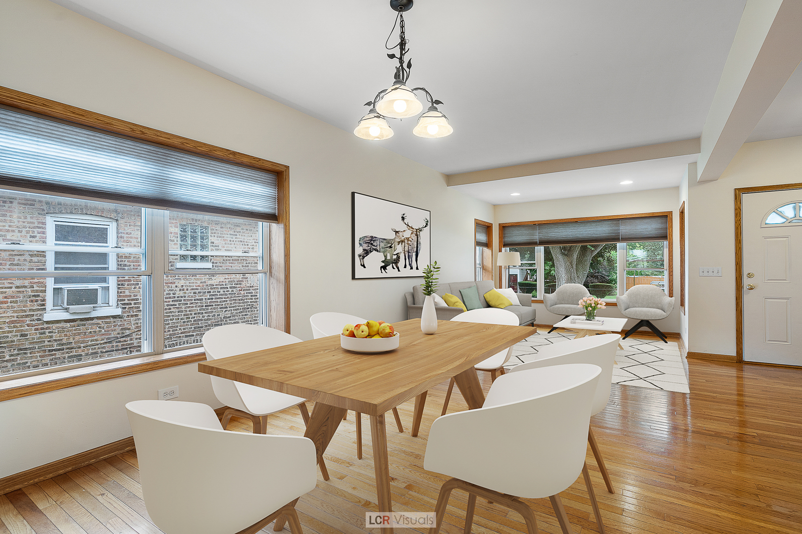 7112 West Belden Avenue Chicago, IL 60707 - Photo 2 of 19 a view of a dining room with furniture wooden floor and a chandelier