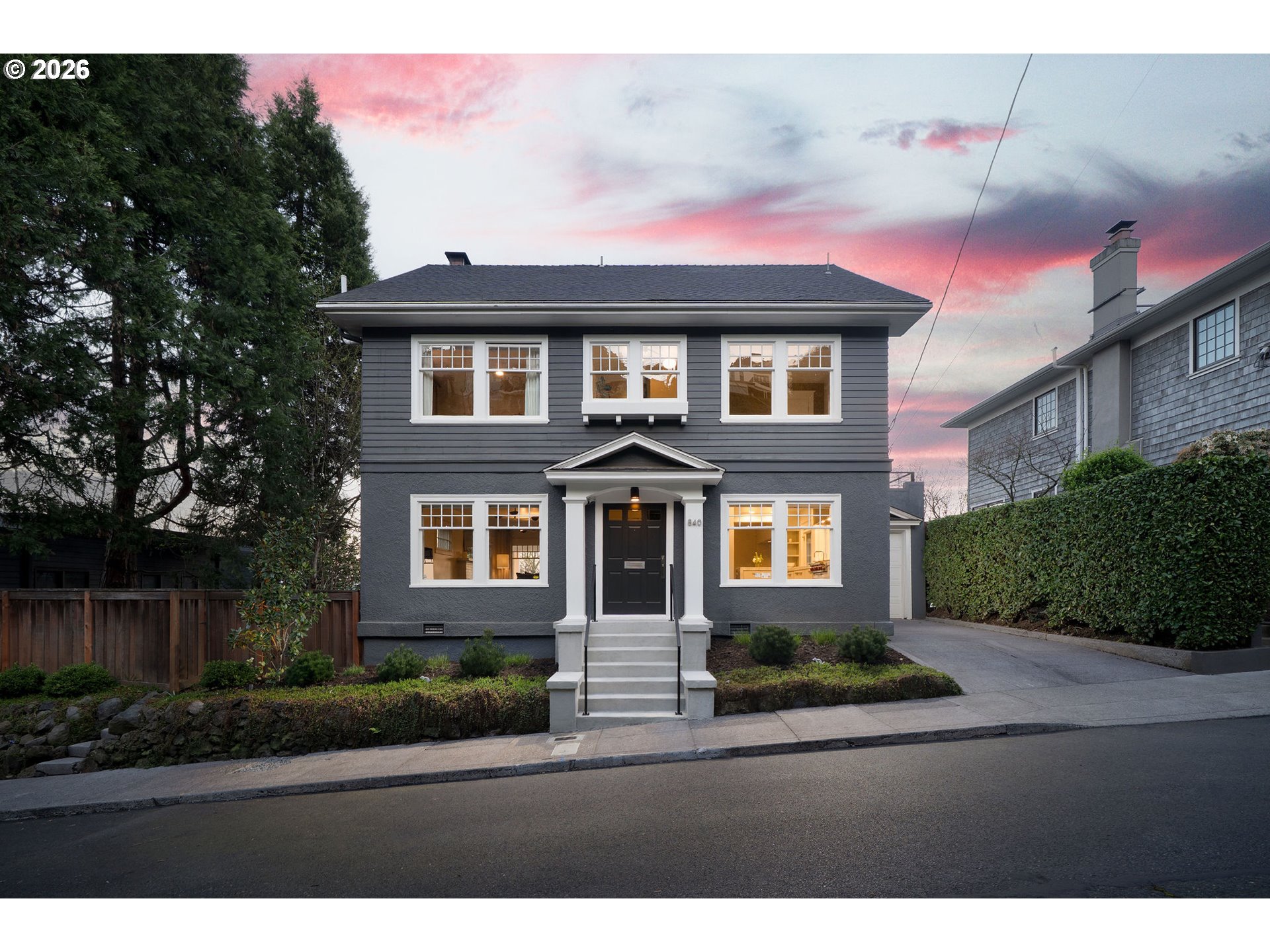 840 Northwest Summit Avenue Portland, OR 97210 - Photo 1 of 48 a front view of a house with yard