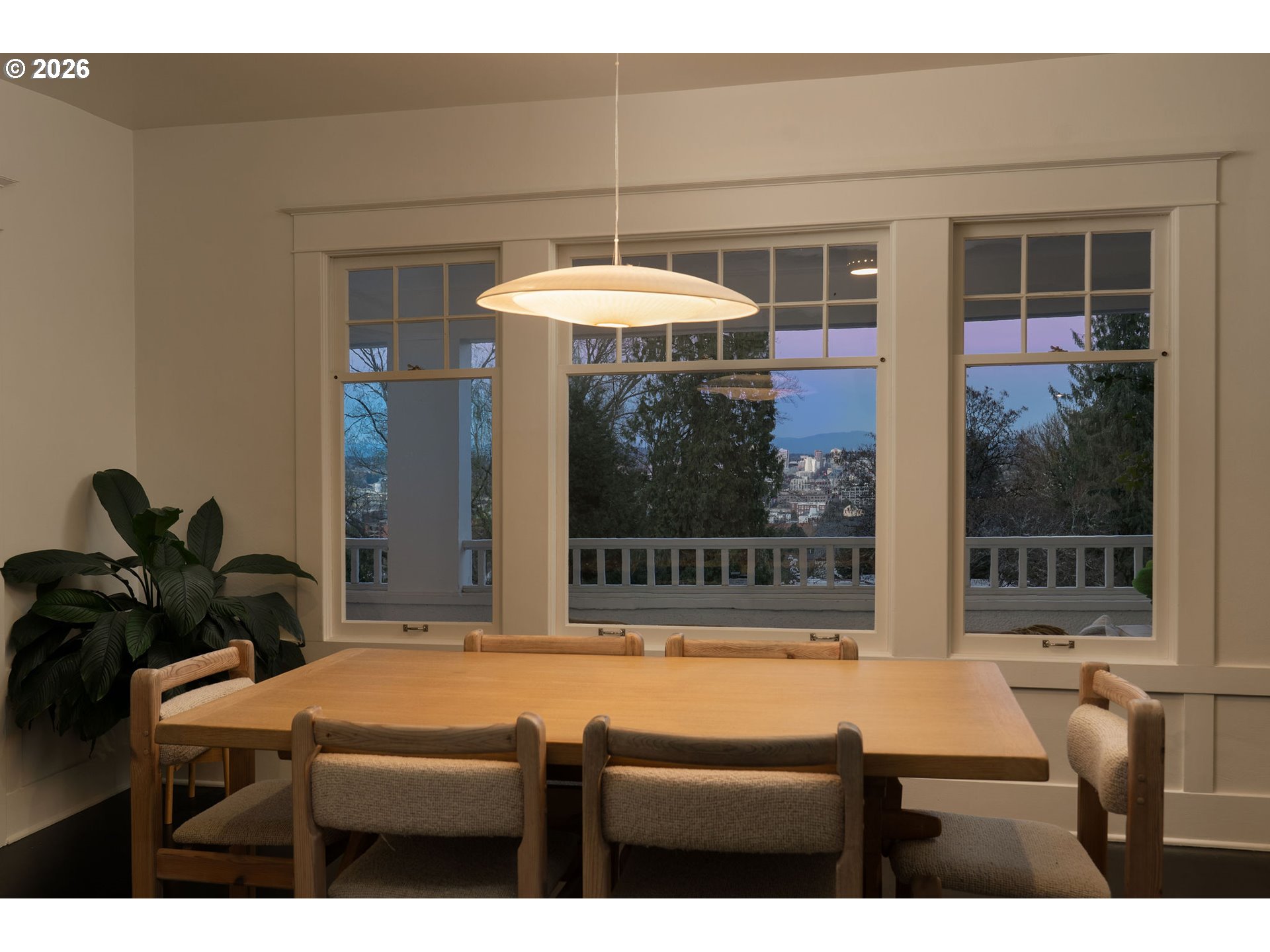 840 Northwest Summit Avenue Portland, OR 97210 - Photo 13 of 48 a room with a table and a potted plant
