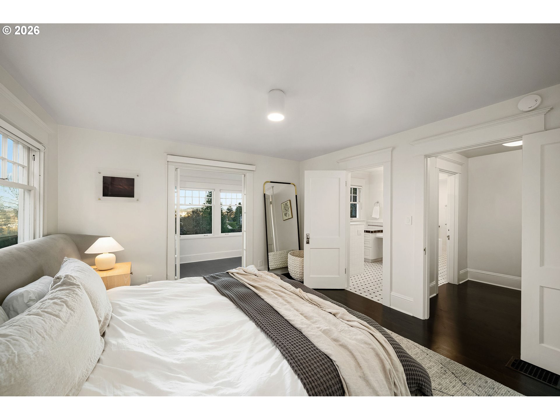 840 Northwest Summit Avenue Portland, OR 97210 - Photo 16 of 48 a bedroom with a bed and a window