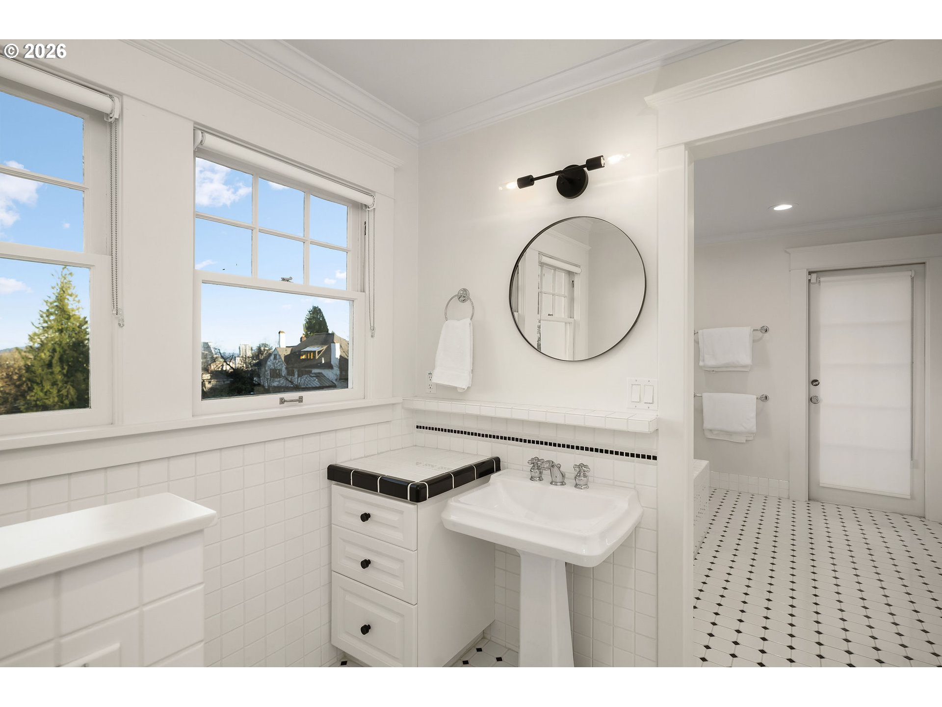 840 Northwest Summit Avenue Portland, OR 97210 - Photo 21 of 48 a bathroom with a sink a mirror and a toilet