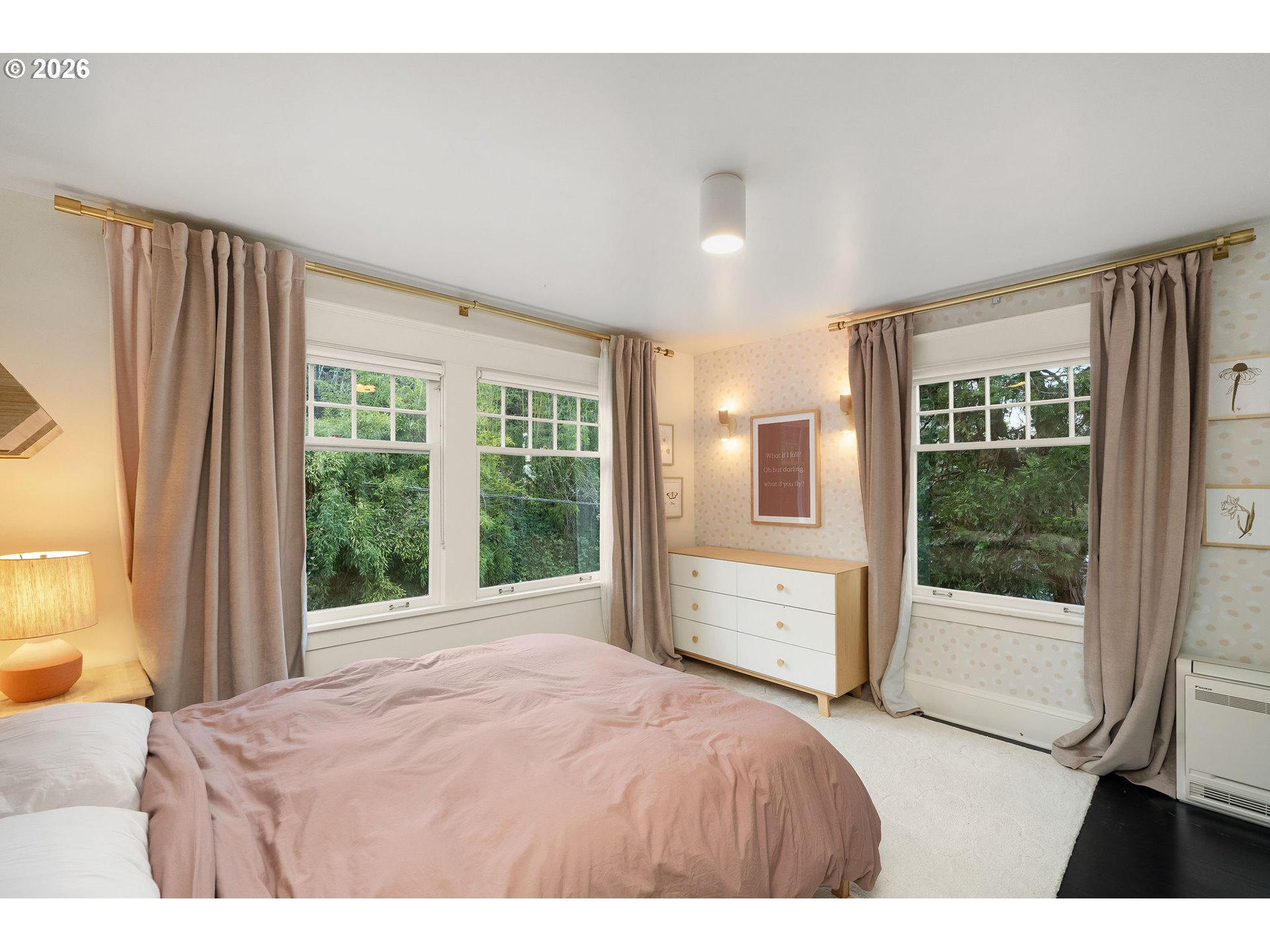 840 Northwest Summit Avenue Portland, OR 97210 - Photo 25 of 48 a bedroom with a large bed and large window