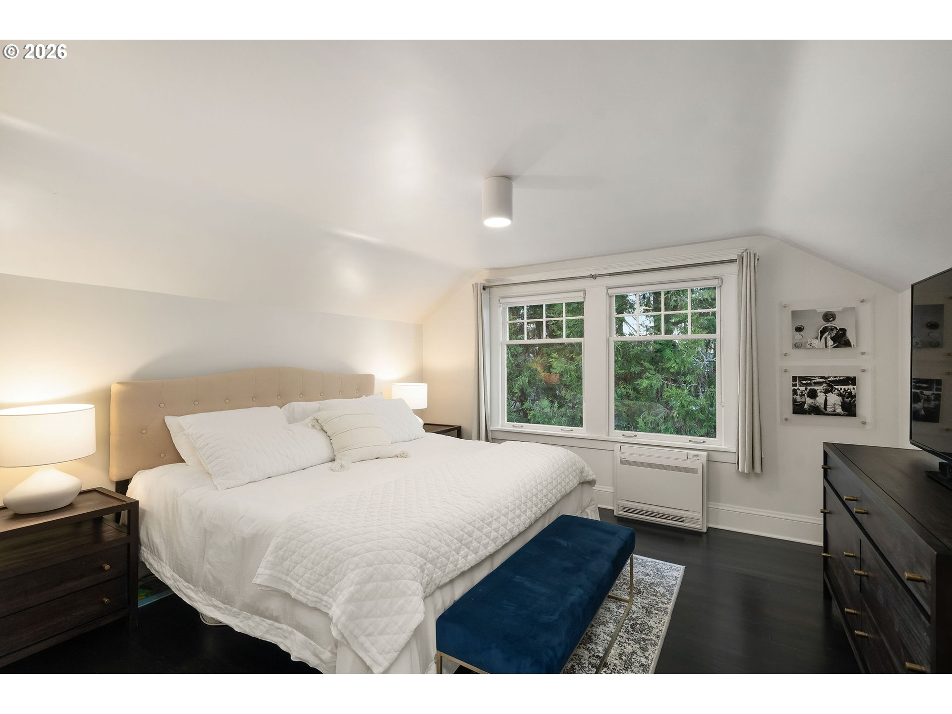840 Northwest Summit Avenue Portland, OR 97210 - Photo 29 of 48 a bedroom with a large bed and a window