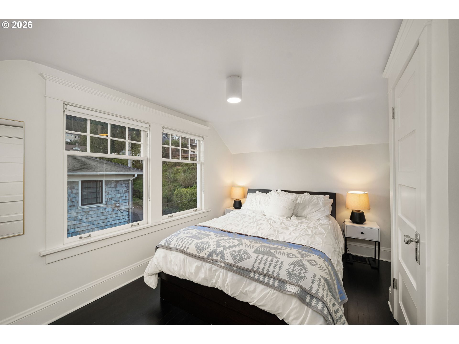 840 Northwest Summit Avenue Portland, OR 97210 - Photo 33 of 48 a bedroom with a bed and a window