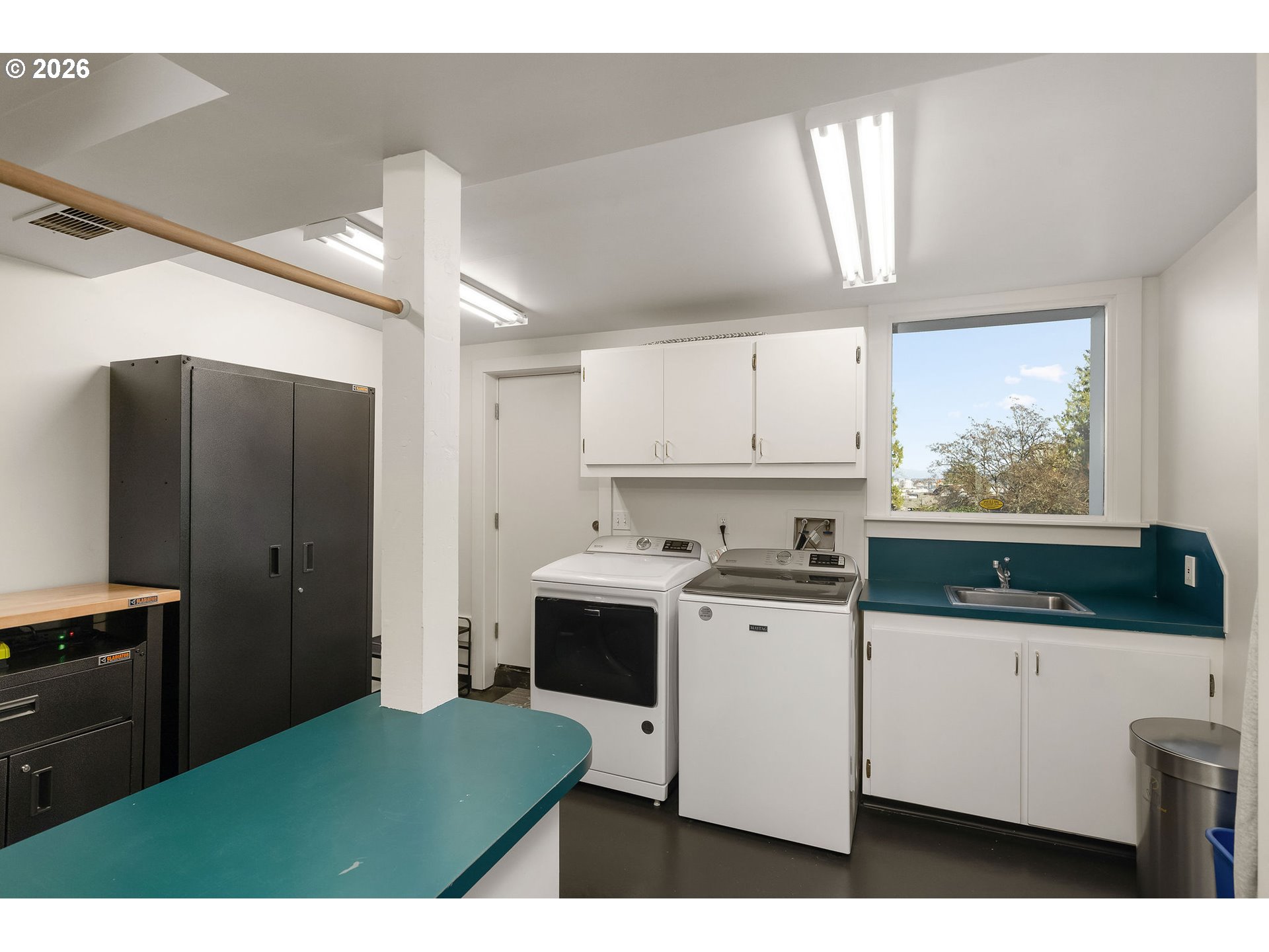 840 Northwest Summit Avenue Portland, OR 97210 - Photo 36 of 48 a kitchen with a sink a refrigerator and window