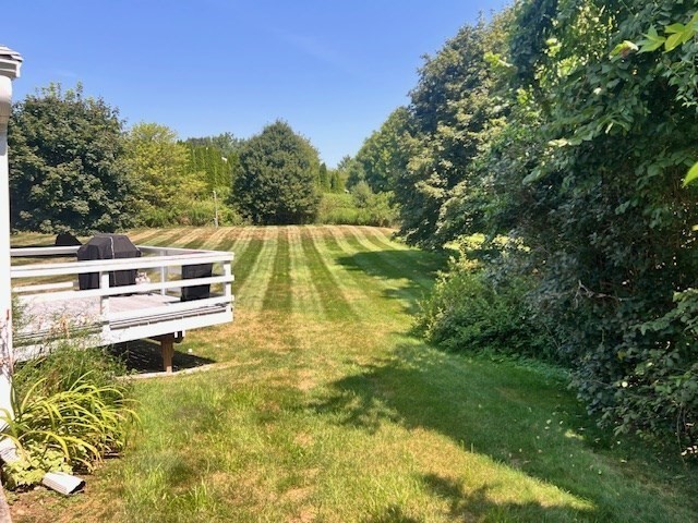 70 Chamberlain Road Westford, MA 01886 - Photo 5 of 25 a backyard of a house with lots of green space