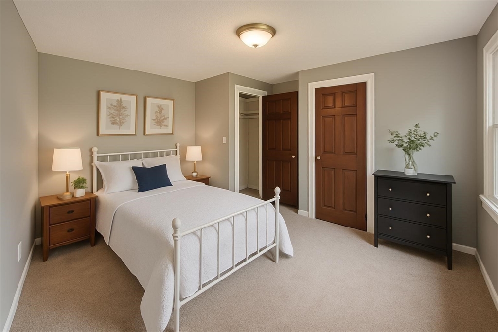 70 Chamberlain Road Westford, MA 01886 - Photo 8 of 25 a bedroom with a bed and a closet