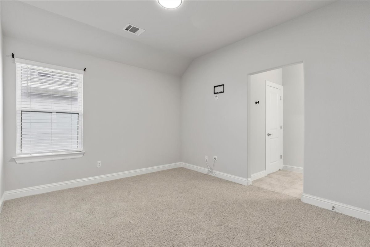101 Free Stone Drive Georgetown, TX 78628 - Photo 24 of 40 Carpeted room with a single window, white baseboards, and light gray walls