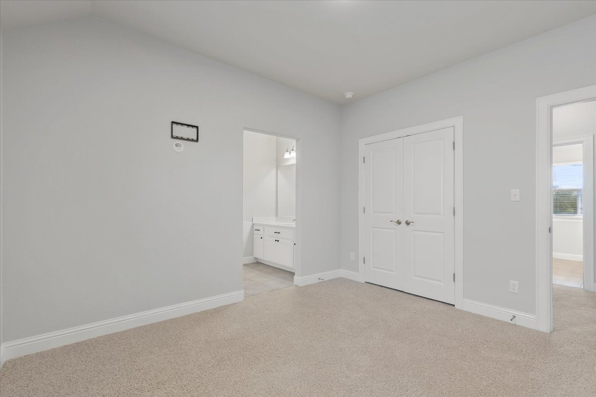 101 Free Stone Drive Georgetown, TX 78628 - Photo 25 of 40 Neutral-toned carpeting extends throughout this room, complemented by light gray wall paint and white baseboards